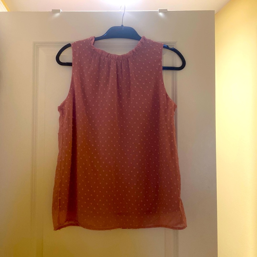 Women’s top with high neck line. Size S.
